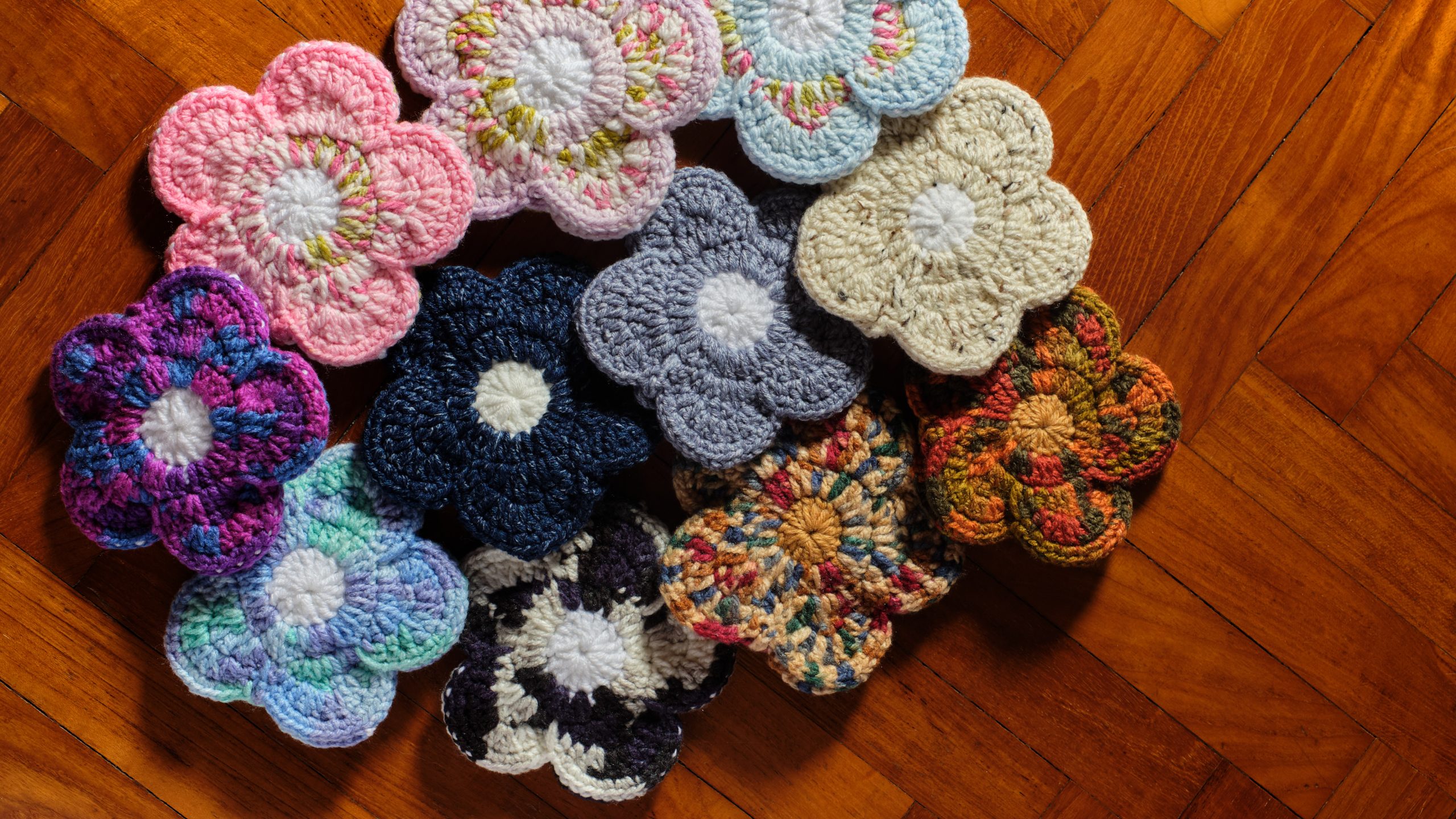 a handmade crochet floral pouch